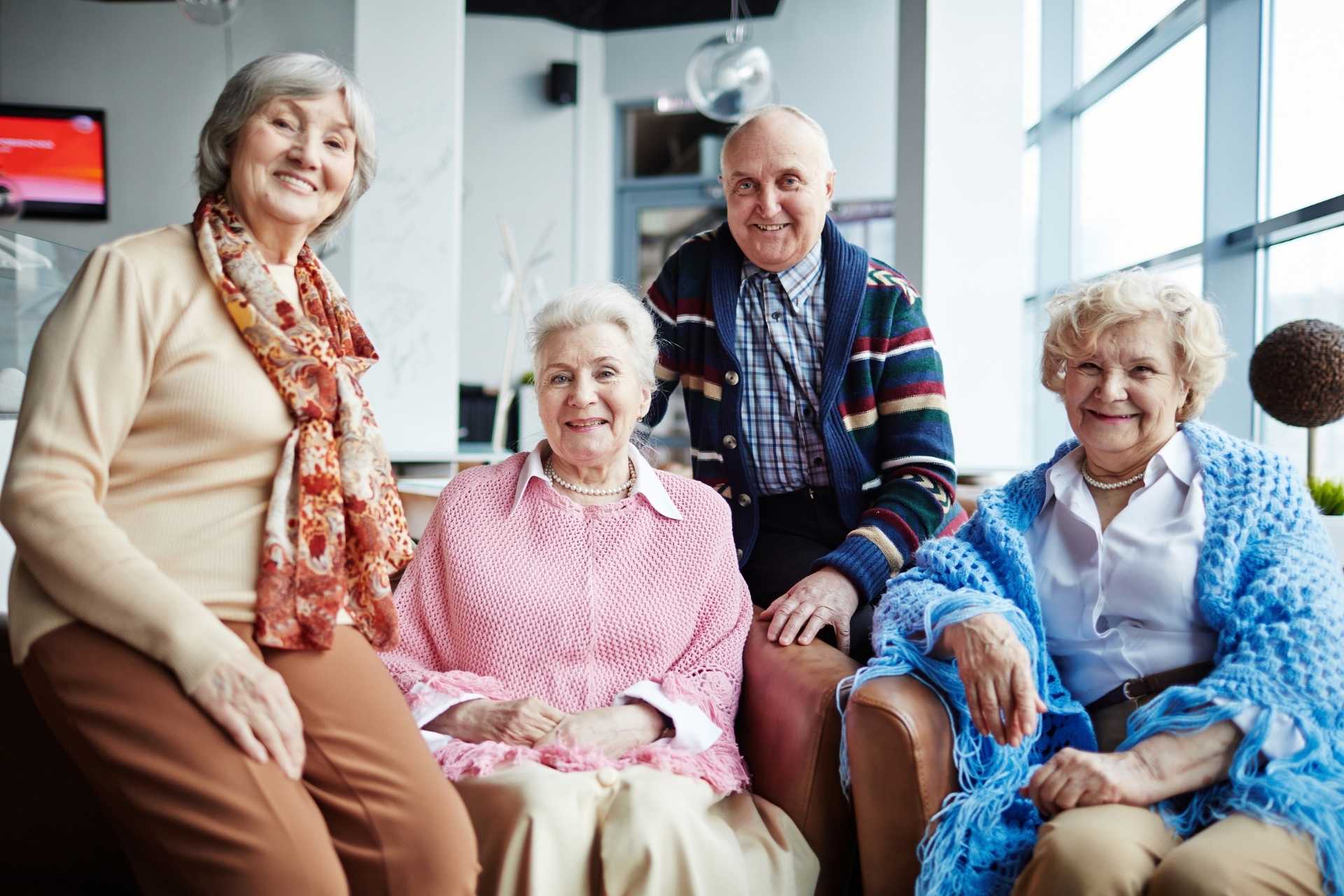 A group of happy seniors posing together and smiling